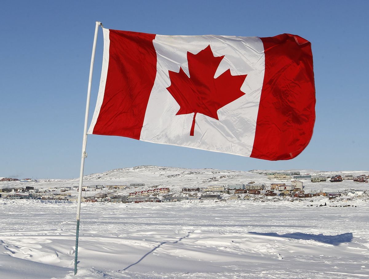 ​A Canadian flag is pictured on Frobisher Bay in Iqaluit, Nunavut February 23, 2012. 