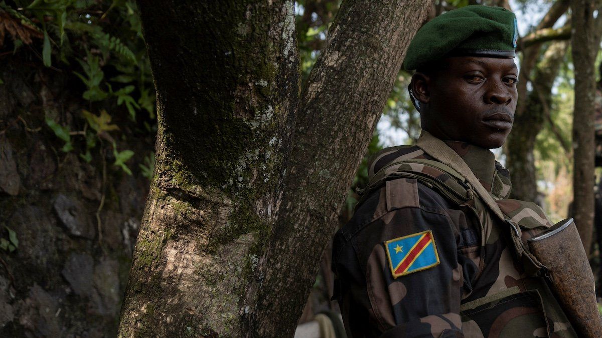 ​A Congolese soldier stands guard as he waits for the ceremony to repatriate the two bodies of South African soldiers killed in the ongoing war between M23 rebels and the Congolese army in Goma, North Kivu province of the Democratic Republic of Congo February 20, 2024. 