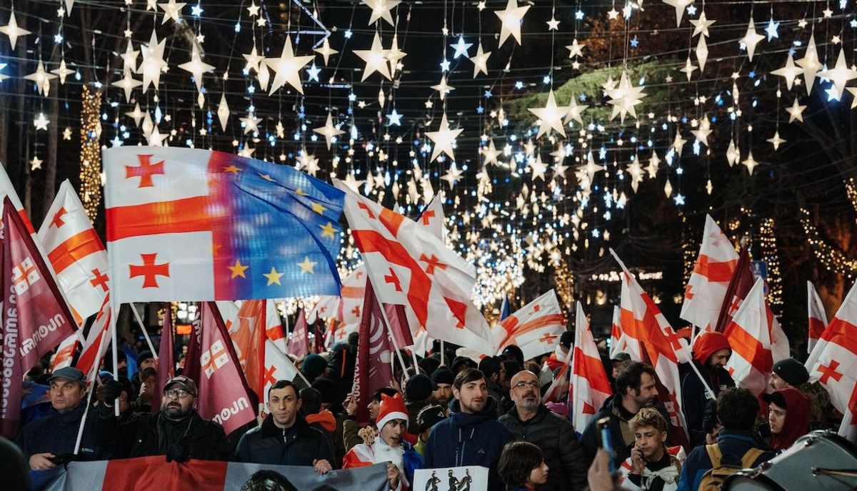 ​A day before the controversial inauguration of Georgian Dream loyalist Mikheil Kavelashvili as the country's new president, Georgian citizens demonstrate with pro-EU placards and Georgian, American, and European Union flags as they protest the government's decision to suspend European membership talks in Tbilisi, Georgia, on Dec. 28, 2024. 