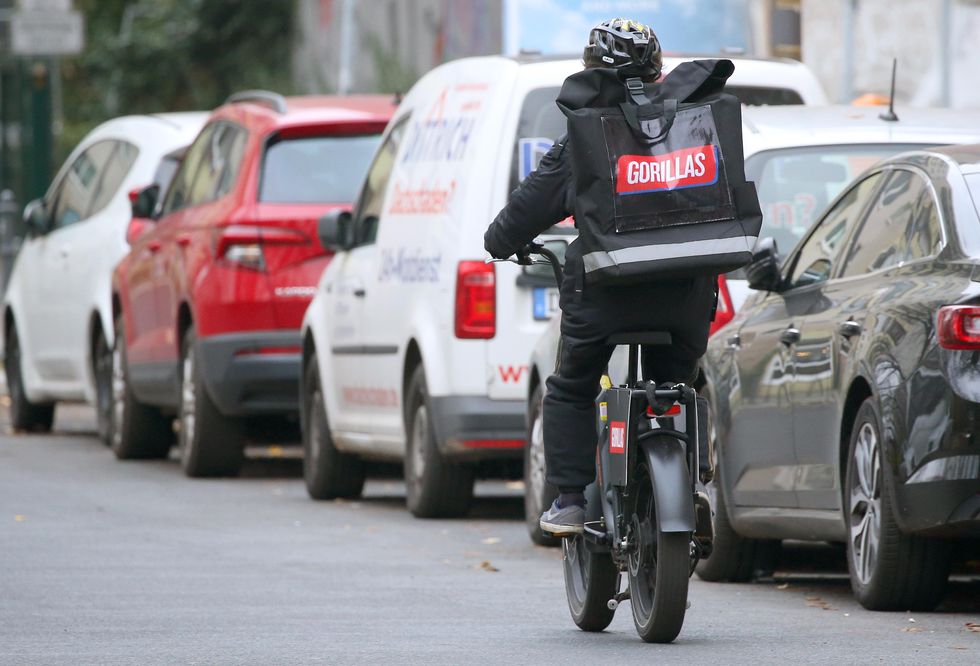 a delivery man riding a bike
