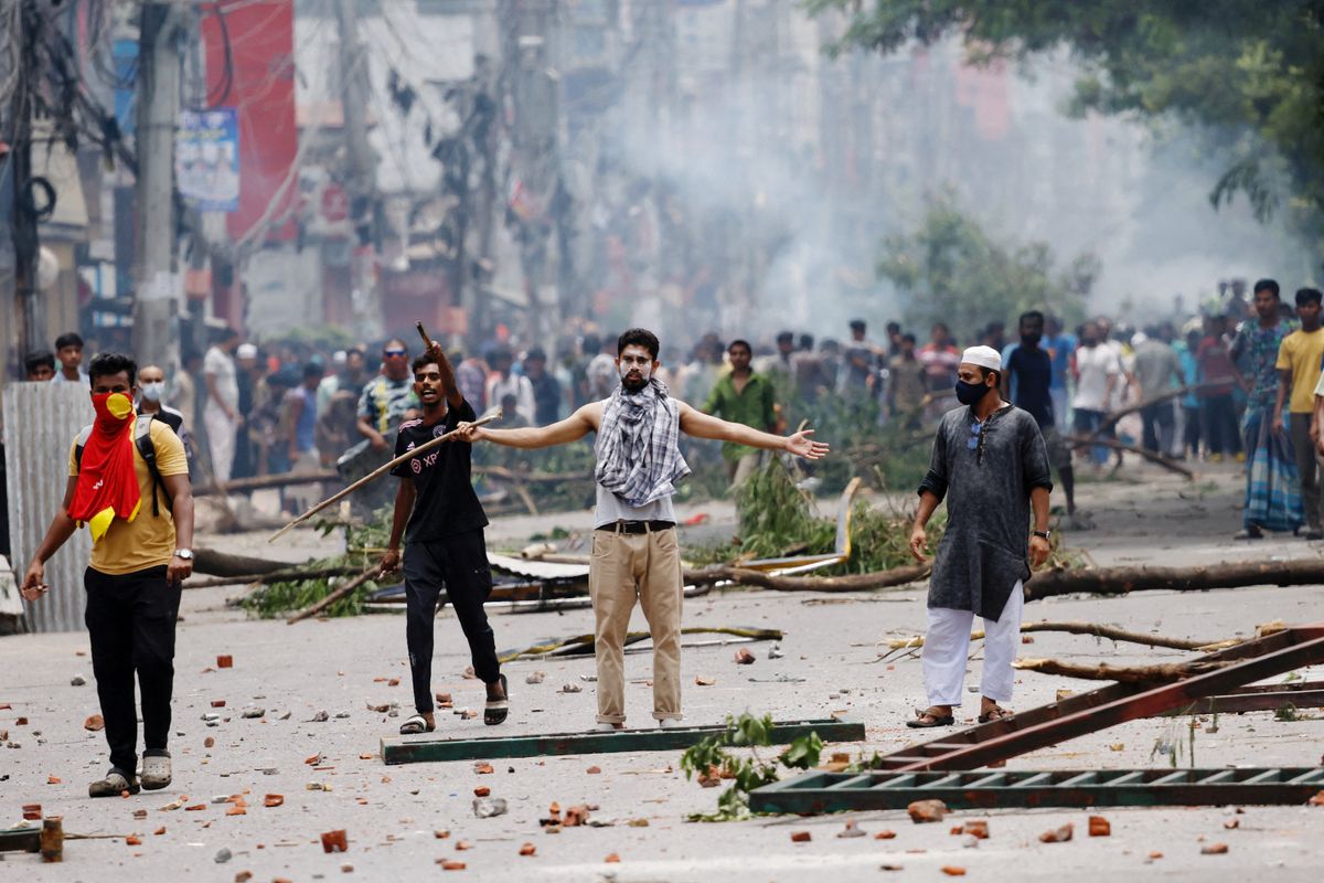 ​A demonstrator gestures as protesters clash with Border Guard Bangladesh (BGB) and the police outside the state-owned Bangladesh Television as violence erupts across the country after anti-quota protests by students, in Dhaka, Bangladesh, July 19, 2024. 