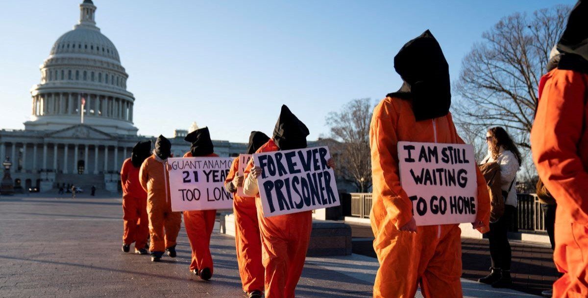 ​A group of people dressed as prisoners protest Guantanamo Bay Detention Camp outside of the U.S. Capitol in Washington, D.C., U.S., January 9, 2023. 