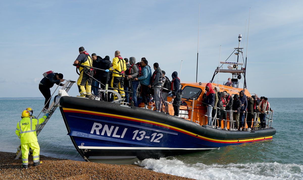 A group of people thought to be migrants arrive in Dungeness, Kent, after being rescued in the Channel by the RNLI following following a small boat incident. 