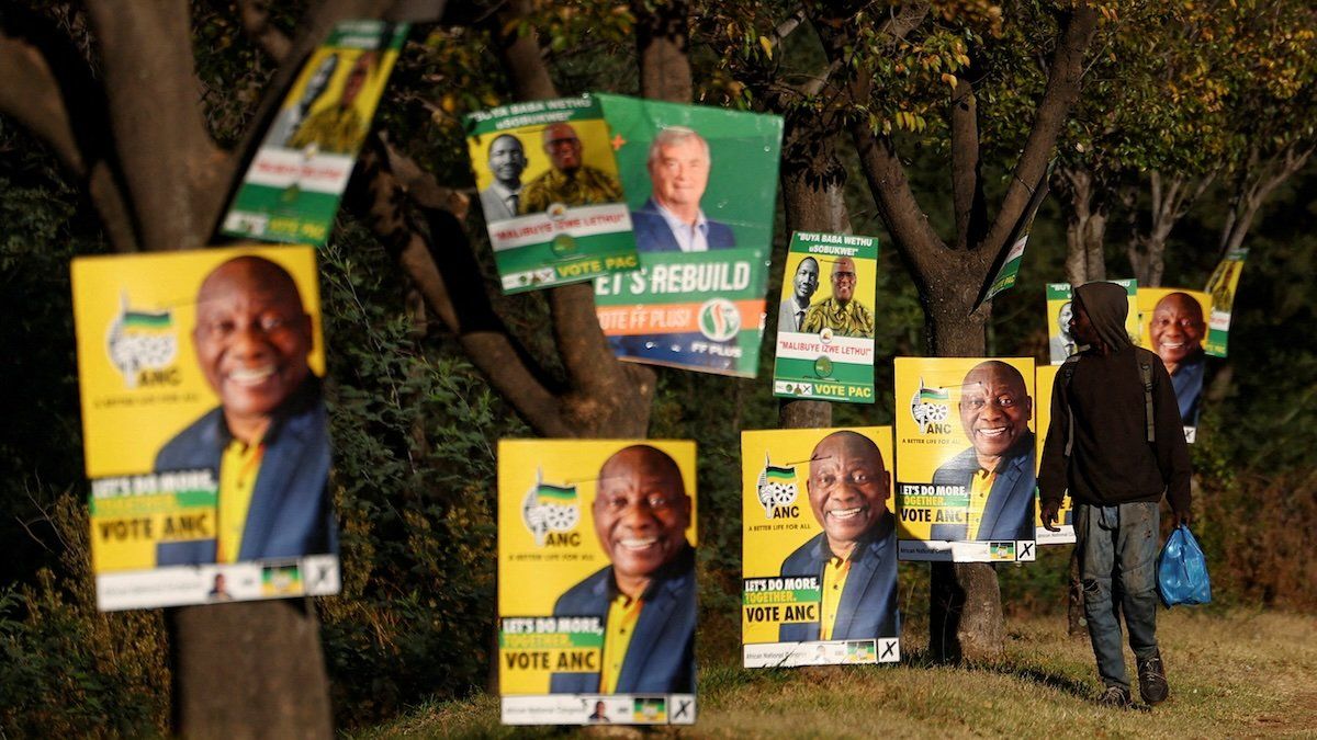 A man walks past election posters of the ruling African National Congress (ANC), as South Africa prepares for the May 29 general elections, in Soweto, South Africa, May 24, 2024.