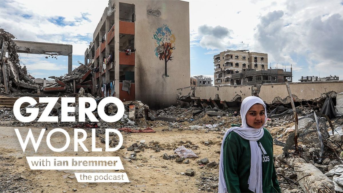 A Palestinian stands amid the rubble of destroyed buildings in Gaza, with a mural of a tree on a damaged wall behind her. The text art reads, "GZERO World with Ian Bremmer—the podcast."