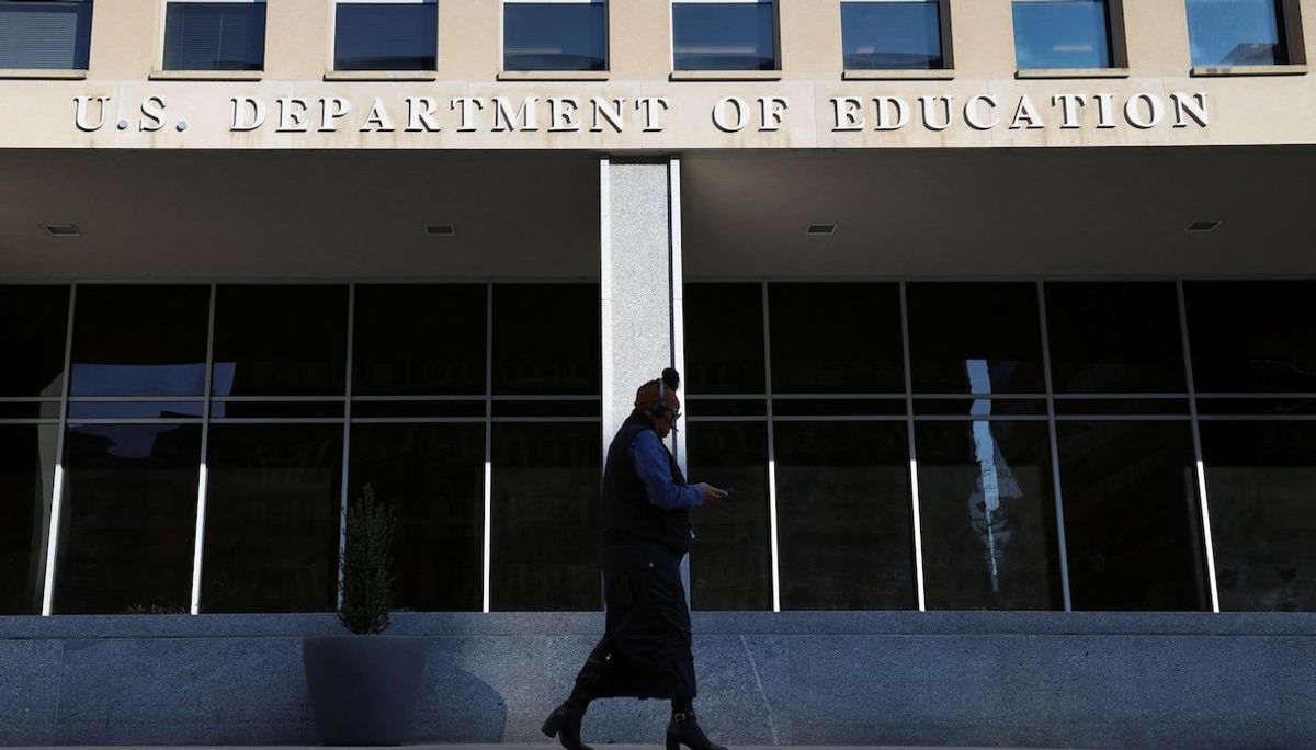 ​A person walks in front of the Department of Education building in Washington, DC, on Feb. 4, 2025.