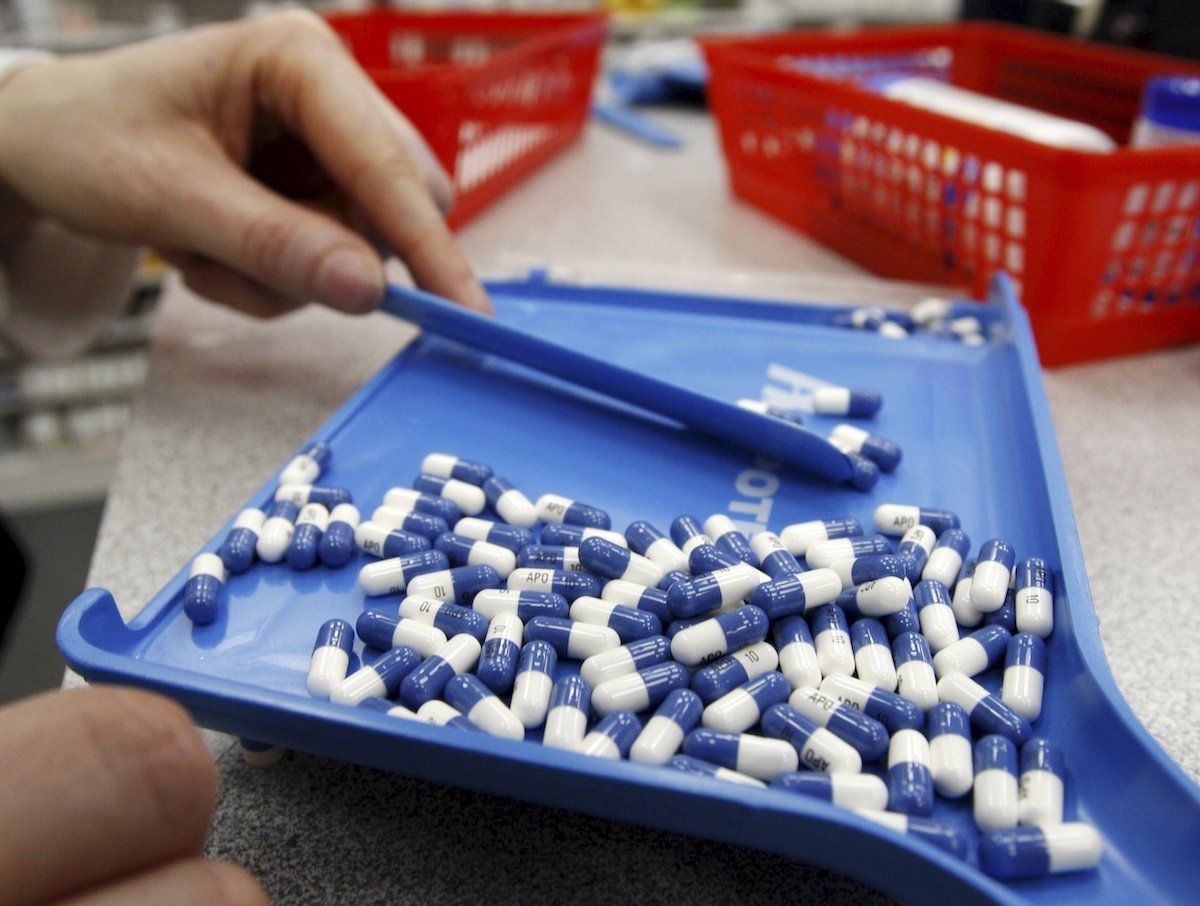 A pharmacist counts pills in a pharmacy in Toronto in this January 31, 2008 file photo. Pressured by an aging population and the need to rein in budget deficits, Canada's provinces are taking tough measures to curb healthcare costs, a trend that could erode the principles of the popular state-funded system.