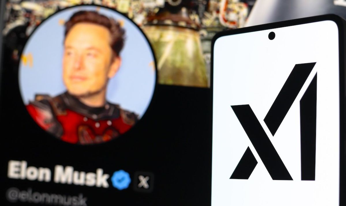 ​A photo illustration with the xAI logo displayed on a smartphone with the official profile of Elon Musk in the background.