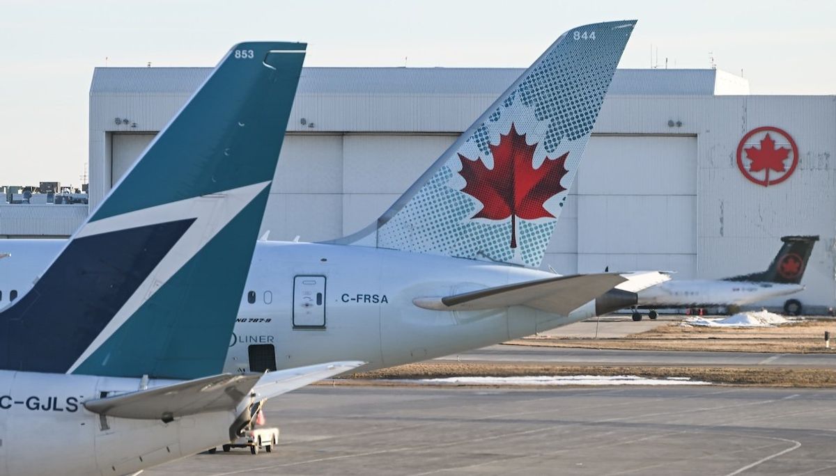 Air Canada and Westjet aircraft parked at Calgary International Airport, in Calgary, Alberta, Canada. 