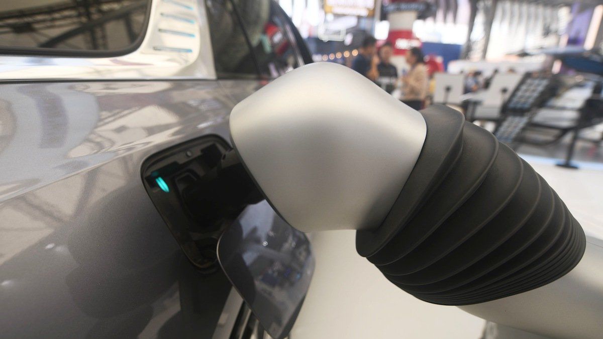 An intelligent charging robot performs autonomous charging for an electric vehicle at the 2024 Bund Conference in Shanghai, China, September 5, 2024. 