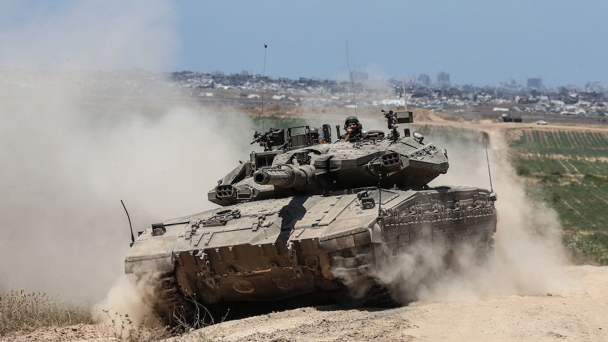 An Israeli army battle tank is moving near the border with the Gaza Strip in southern Israel on May 16, 2024, amid the ongoing conflict in the Palestinian territory between Israel and the Hamas movement. 