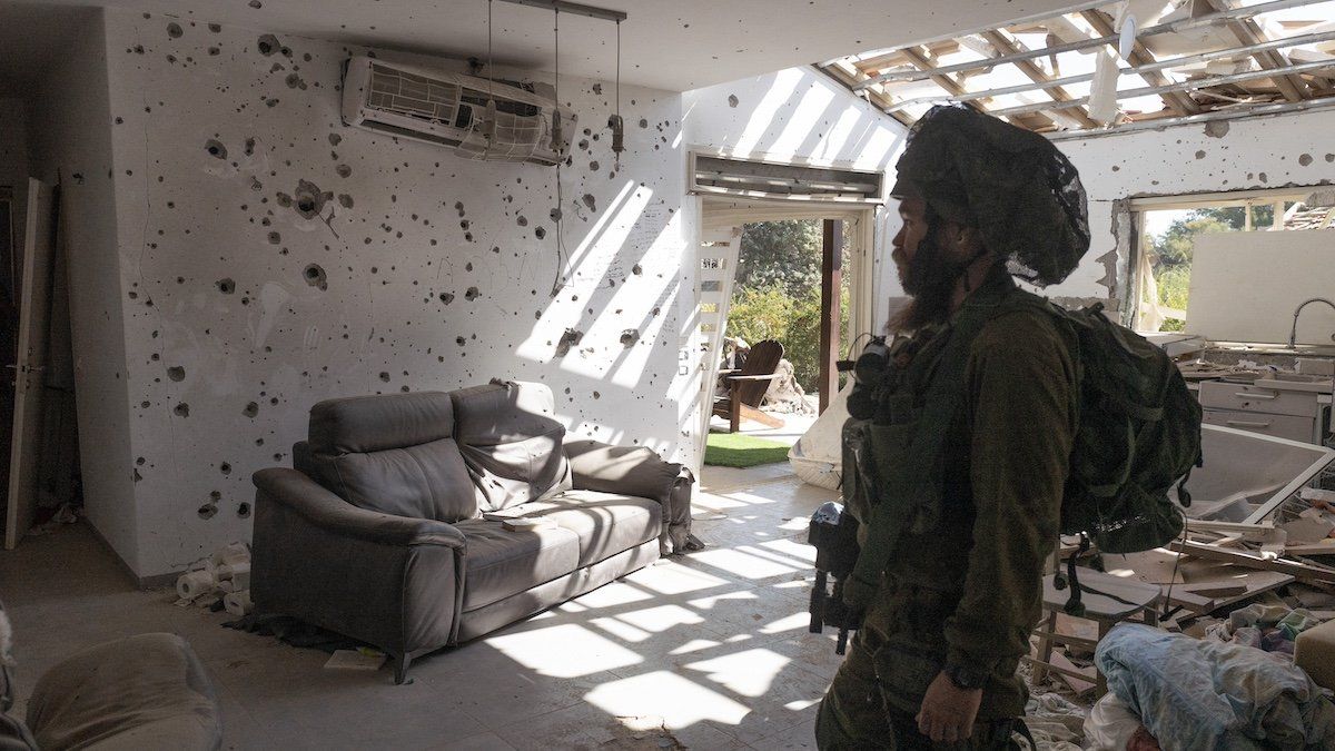 ​An Israeli infantry soldier inside a Jewish home in Kibbutz Be’eri that was destroyed by Hamas in their October 7, 2023 infiltration of southern Israeli communities. This community was attacked by Hamas infiltrators who killed some 100 people out of 1000 who lived in this community on October 7, 2023. 