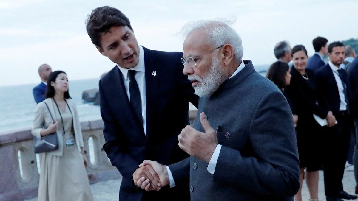 Canada's Prime Minister Justin Trudeau shakes hands with Indian Prime Minister Narendra Modi after the family photo with invited guests at the G7 summit in Biarritz, France, August 25, 2019.