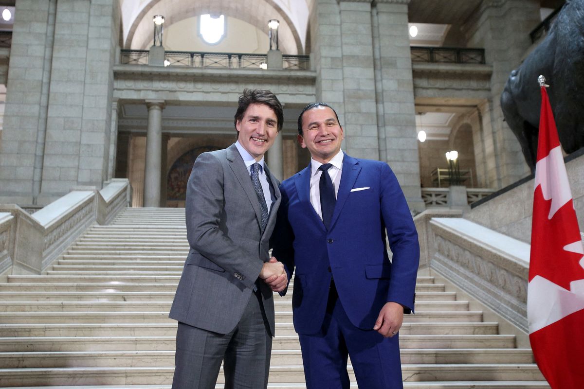 ​Canada’s Prime Minister Justin Trudeau and Manitoba Premier Wab Kinew shake hands as they meet at the Manitoba Legislative Building in Winnipeg, Manitoba, Canada February 15, 2024. 