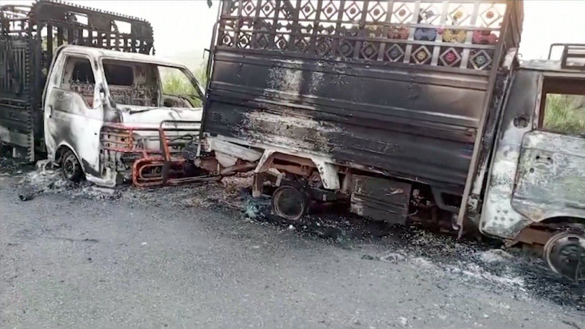 Charred vehicles in Balochistan province, Pakistan, following separatist militant attacks.