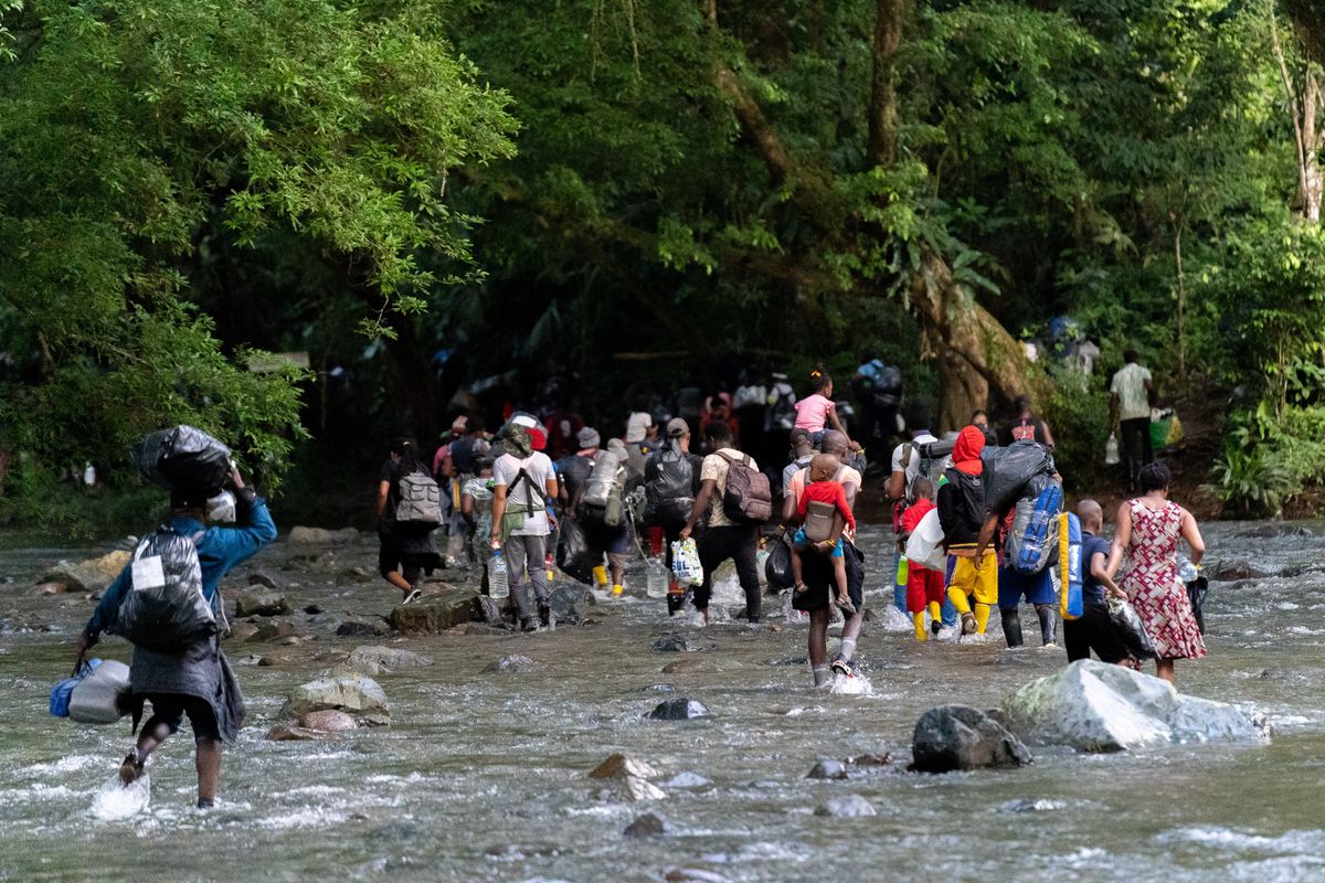Colombia, Acandi, 2021-10-29. Haitian migrants trek through the Darien Gap towards the border with Panama. Photograph by Yader Guzman / Hans Lucas Colombie, Acandi, 2021-10-29. Des migrants haitiens traversent le Darien Gap en direction de la frontiere avec le Panama. 