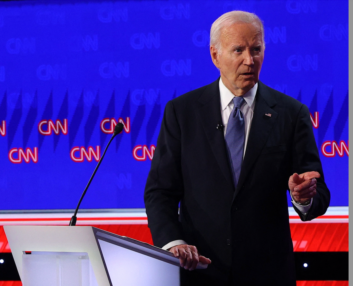 ​Democrat candidate, U.S. President Joe Biden, points during a presidential debate with Republican candidate, former U.S. President Donald Trump, in Atlanta, Georgia, U.S., June 27, 2024. 