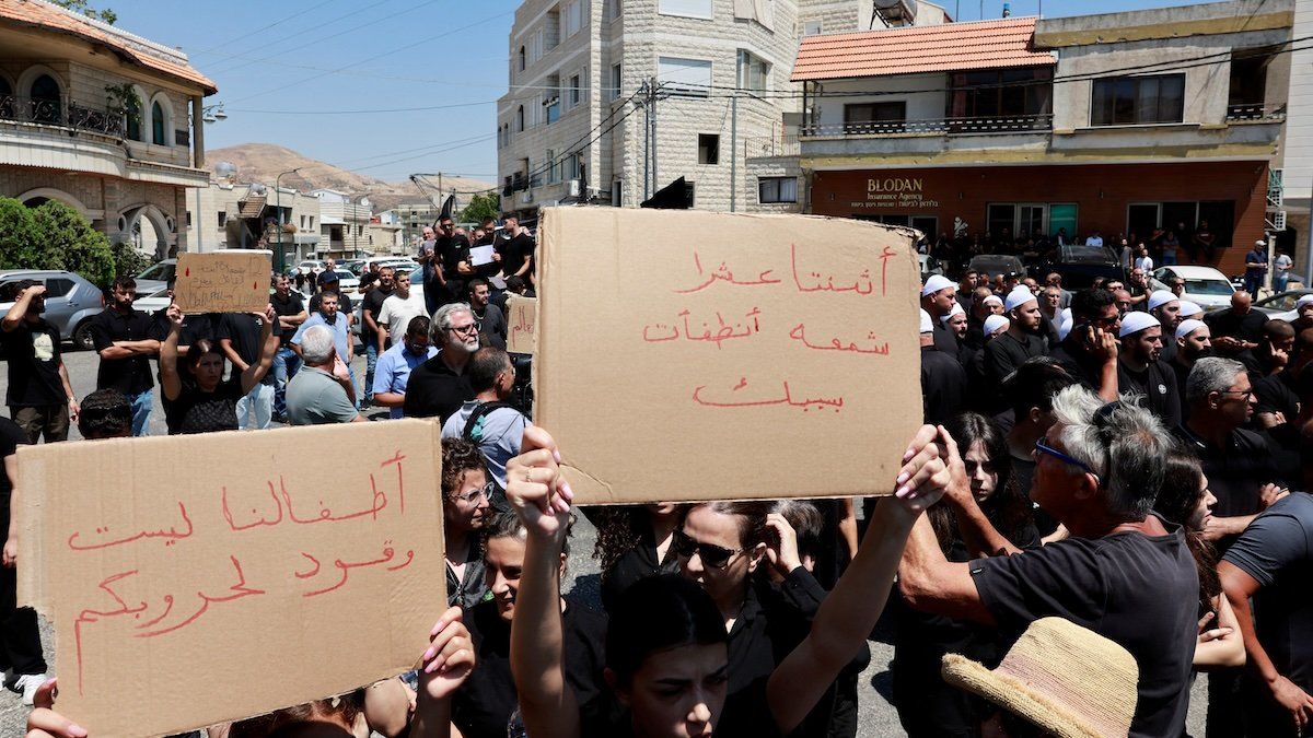 Druze residents protest a visit of Israeli Prime Minister Benjamin Netanyahu to the scene where children and teens were killed at a soccer pitch by a rocket Israel says was fired from Lebanon, in Majdal Shams, a Druze village in the Israeli-occupied Golan Heights, July 29, 2024.