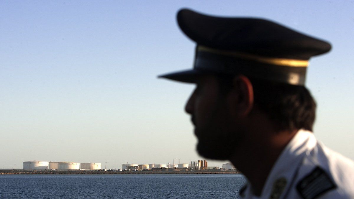 ​EDITORS' NOTE: Reuters and other foreign media are subject to Iranian restrictions on leaving the office to report, film or take pictures in Tehran. A security personnel looks on at oil docks at the port of Kalantari in the city of Chabahar, 300km (186 miles) east of the Strait of Hormuz January 17, 2012. 