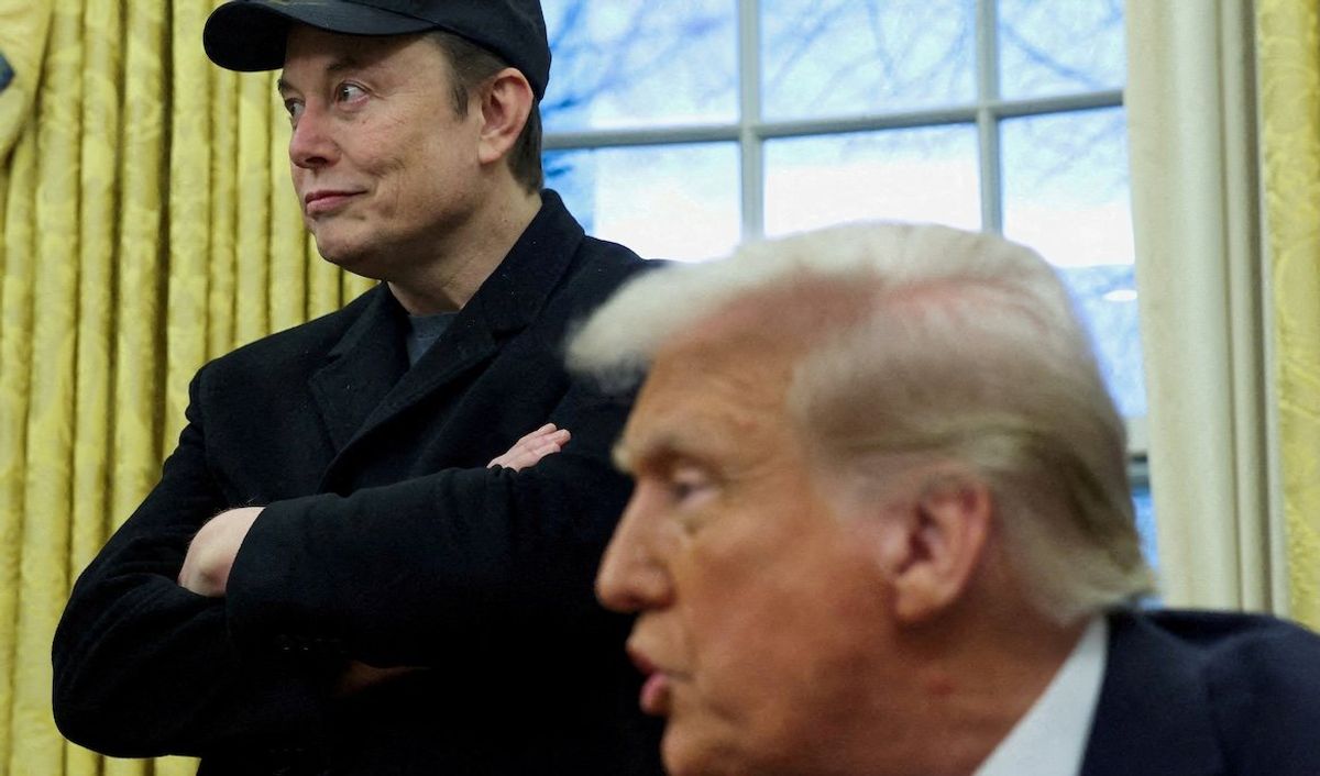 Elon Musk listens as President Donald Trump speaks in the Oval Office of the White House in Washington, DC, on Feb. 11, 2025. 