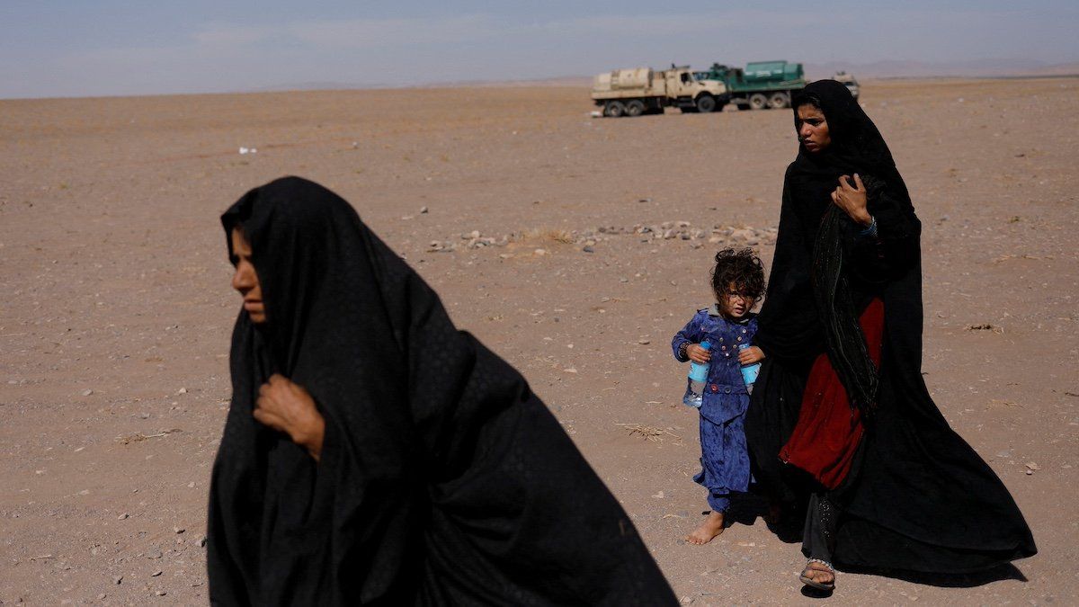 ​FILE PHOTO: Afghan women walk after the recent earthquake in the district of Zinda Jan, in Herat, Afghanistan October 10, 2023. 