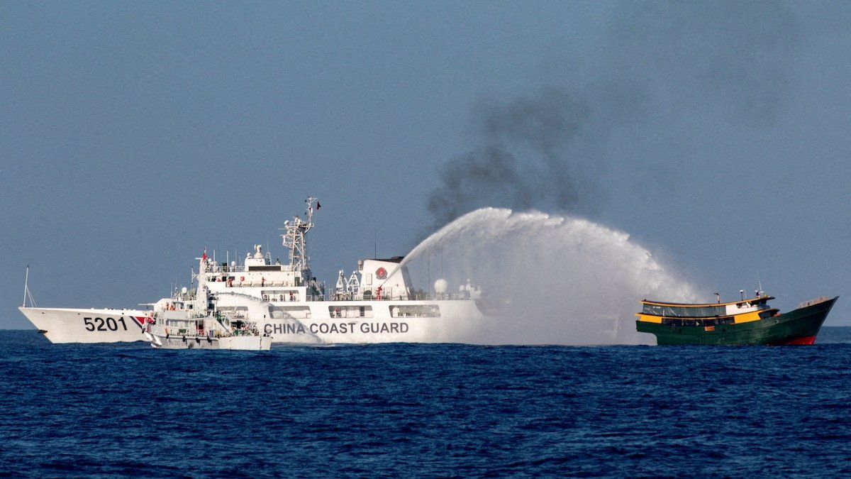 FILE PHOTO: Chinese Coast Guard vessels fire water cannons towards a Philippine resupply vessel Unaizah on May 4 as it made its way to the Second Thomas Shoal in the South China Sea, March 5, 2024. 