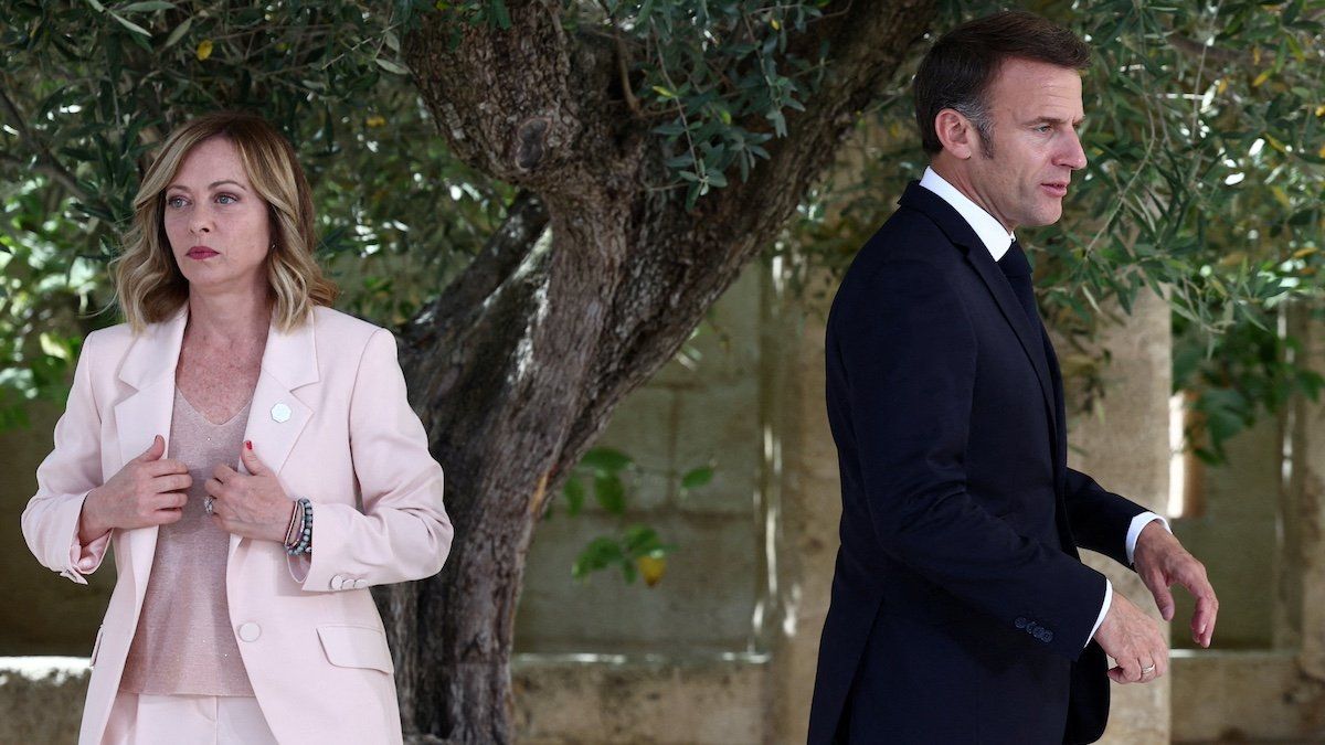 ​FILE PHOTO: French President Emmanuel Macron walks next to Italy's Prime Minister Giorgia Meloni on the first day of the G7 summit, at the Borgo Egnazia resort, in Savelletri, Italy June 13, 2024. 