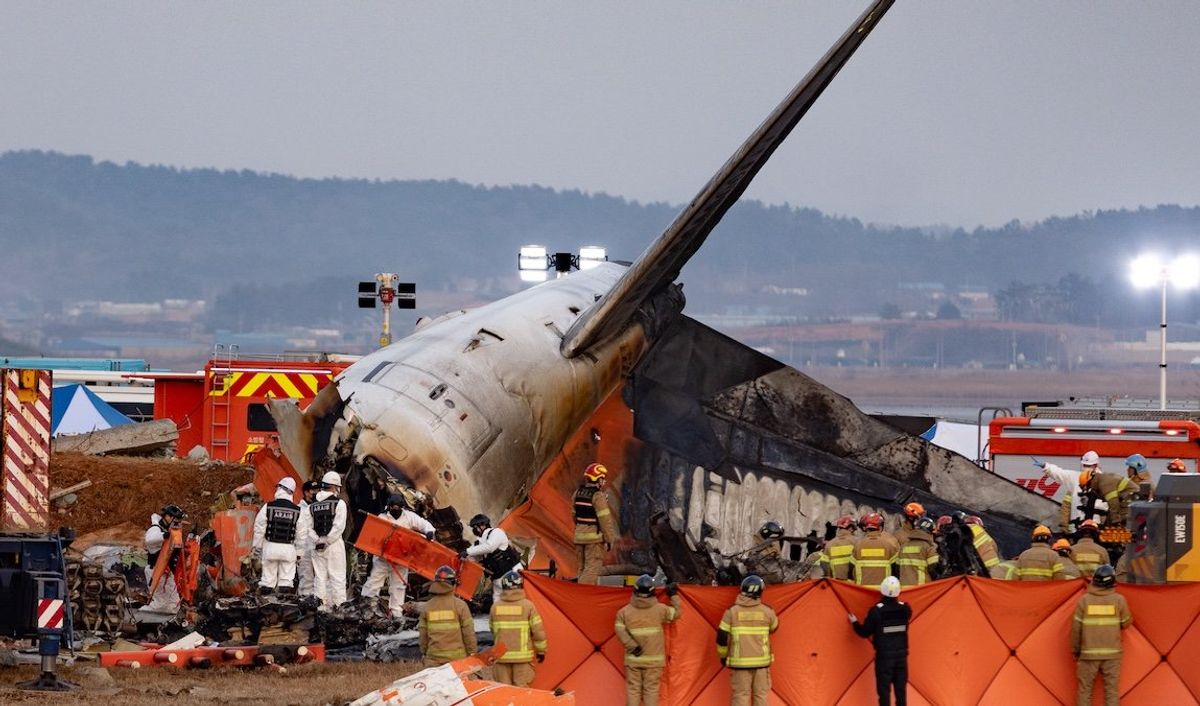 Fire authorities search for the missing and recover the deceased at the site of an accident near Muan International Airport in Jeollanam-do, South Korea, on Dec. 29, 2024.