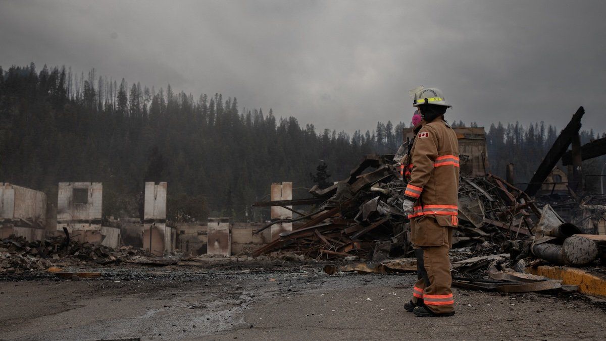 Fire crews work to put out hotspots in the Maligne Lodge in Jasper, Alberta, Canada, on Friday July 26, 2024. 