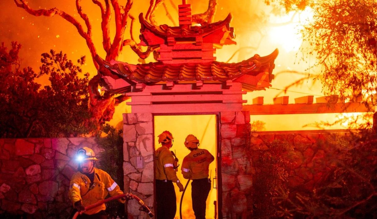 ​Firefighters battle the Palisades Fire as it burns during a windstorm on the west side of Los Angeles, California, on Jan. 8, 2025.