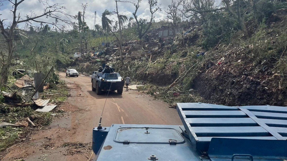 ​French Gendarmerie forces cross a damaged area in the aftermath of Cyclone Chido, in Mayotte, France December 15, 2024. 