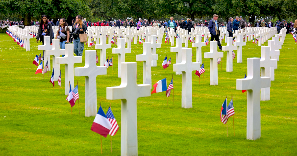 ​Illustration of the graves at the Normandy American Cemetery and Memorial after the US ceremony marking the 80th anniversary of the World War II D-Day Allied landings in Normandy, in Colleville-sur-Mer, France, on June 6, 2024. 