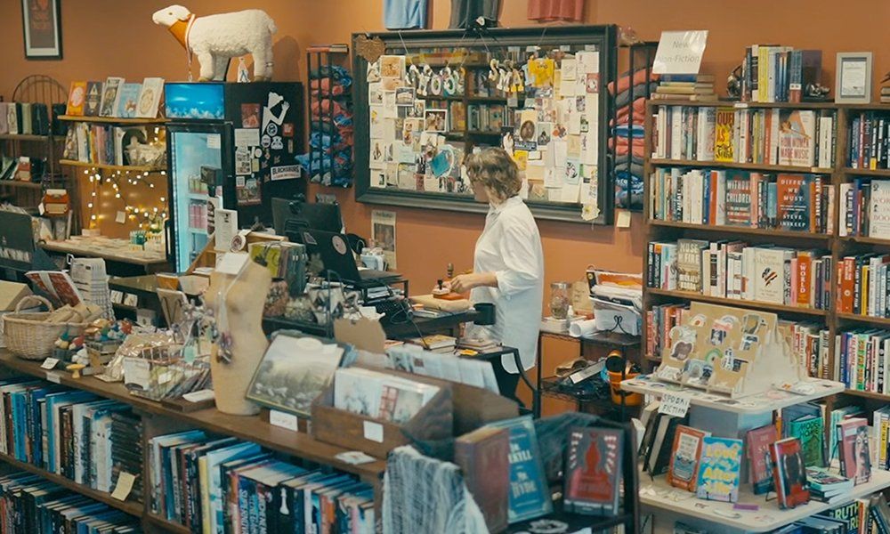 Woman at the cash counter of a bookstore 