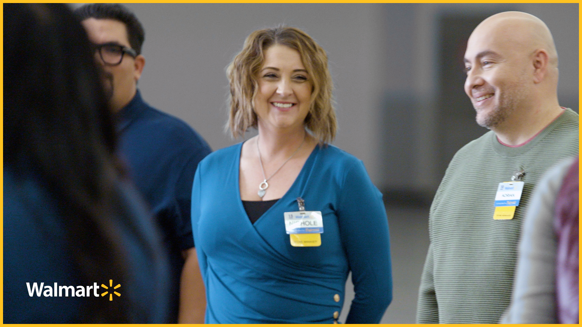 Walmart associate standing in a group