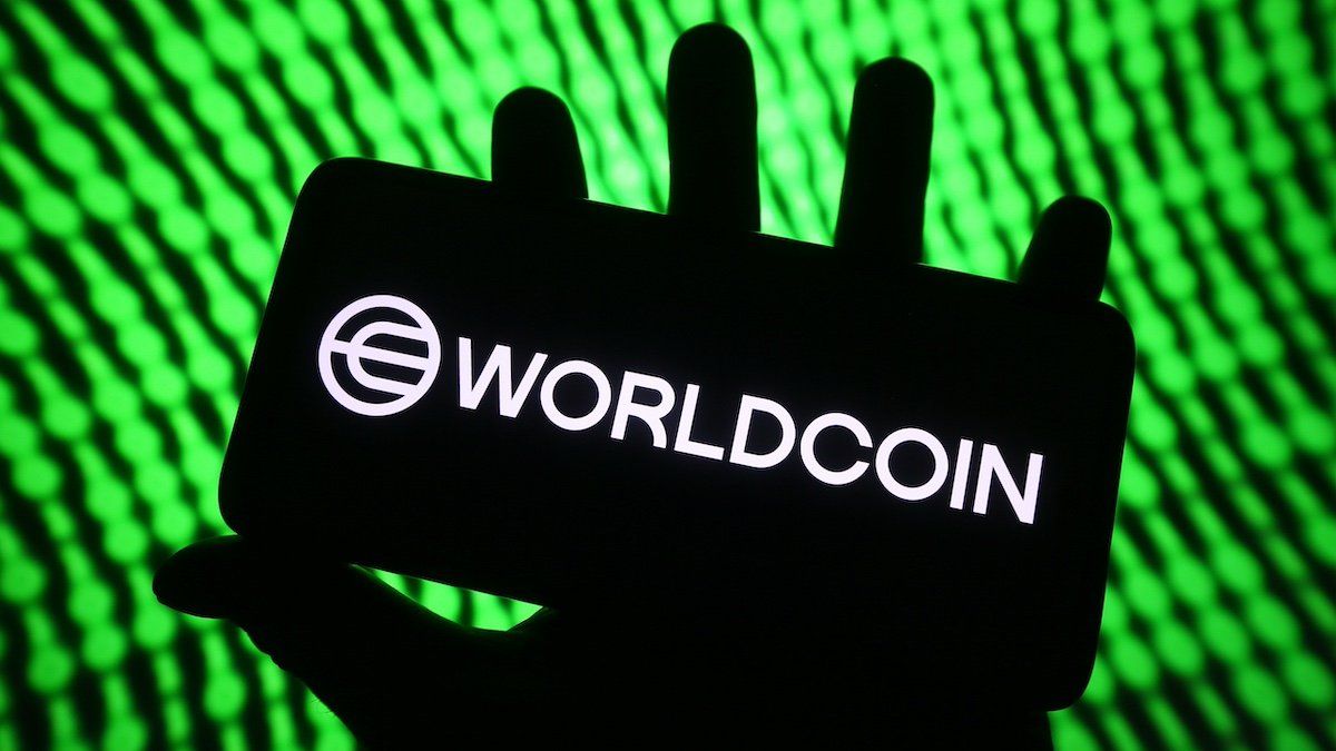 In this photo illustration, Worldcoin logo is seen on a smartphone screen.