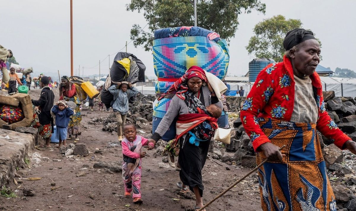 ​Internally displaced civilians from the camps in Munigi and Kibati carry their belongings as they flee following the fight between M23 rebels and the Armed Forces of the Democratic Republic of the Congo, in Goma, Democratic Republic of Congo, on Jan. 26, 2025. 