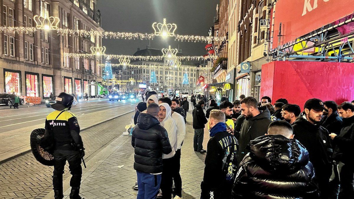 Israeli Maccabi Tel Aviv supporters are guarded by police after violence targeting Israeli football fans broke out in Amsterdam overnight, in Amsterdam, Netherlands, November 8, 2024.