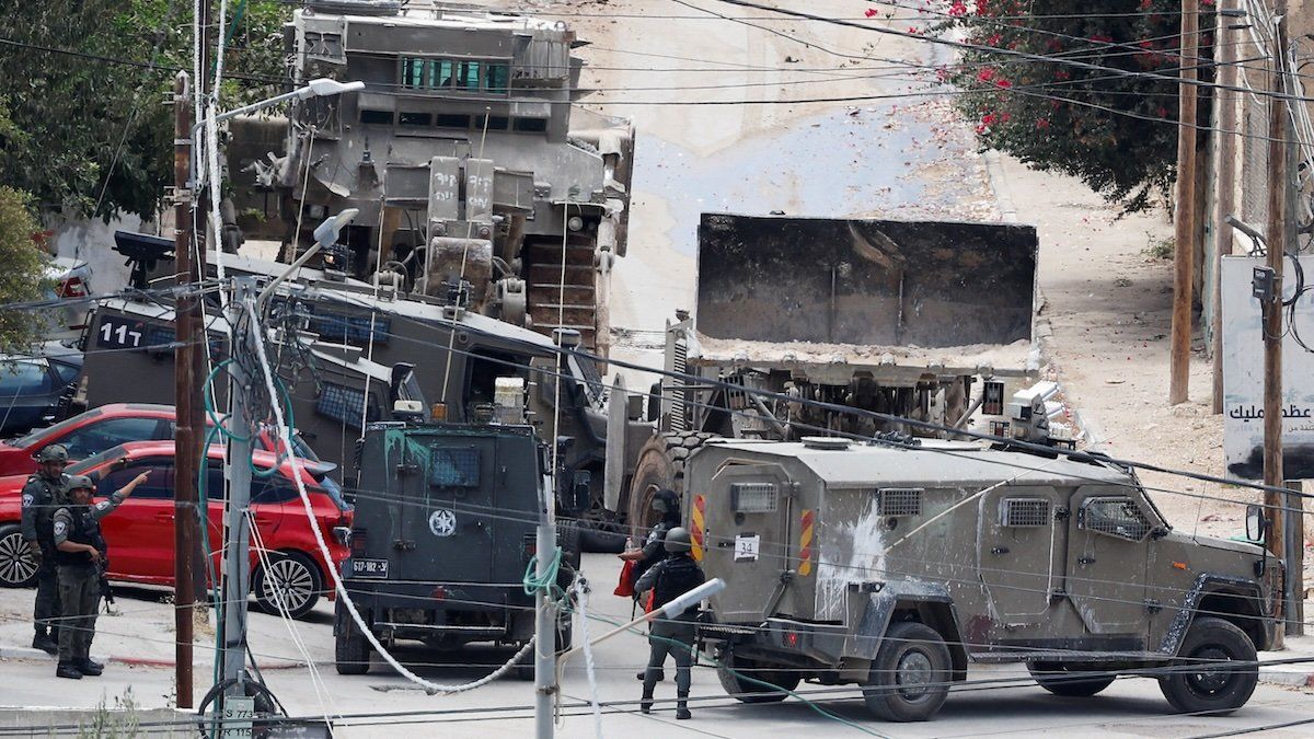 Israeli security forces members take part in a raid, in Jenin, in the Israeli-occupied West Bank, August 28, 2024.