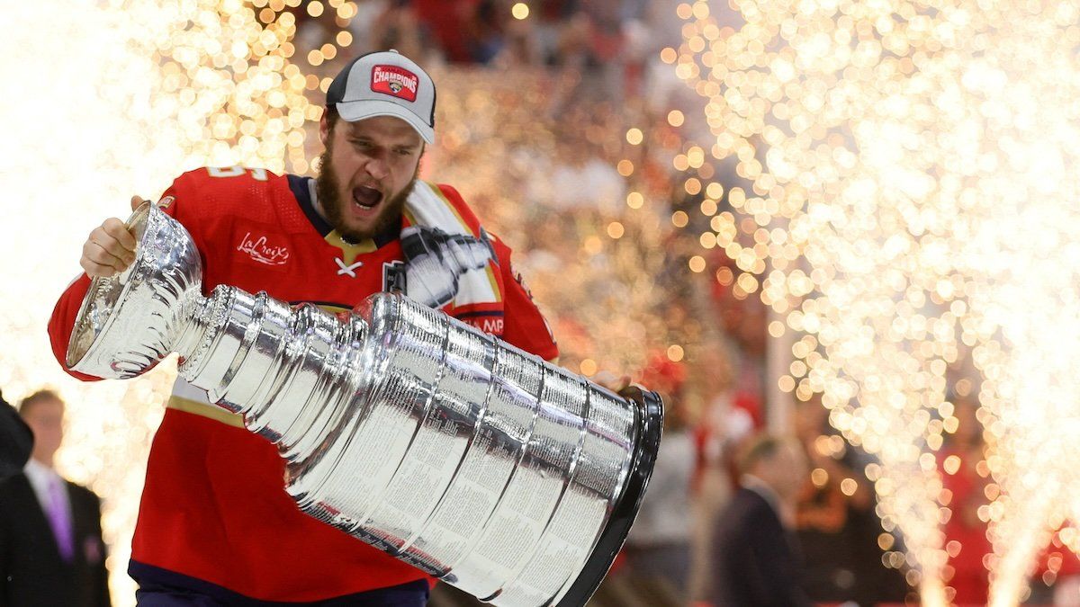 Jun 24, 2024; Sunrise, Florida, USA; Florida Panthers forward Aleksander Barkov (16) hoists the Stanley Cup after defeating the Edmonton Oilers in game seven of the 2024 Stanley Cup Final at Amerant Bank Arena