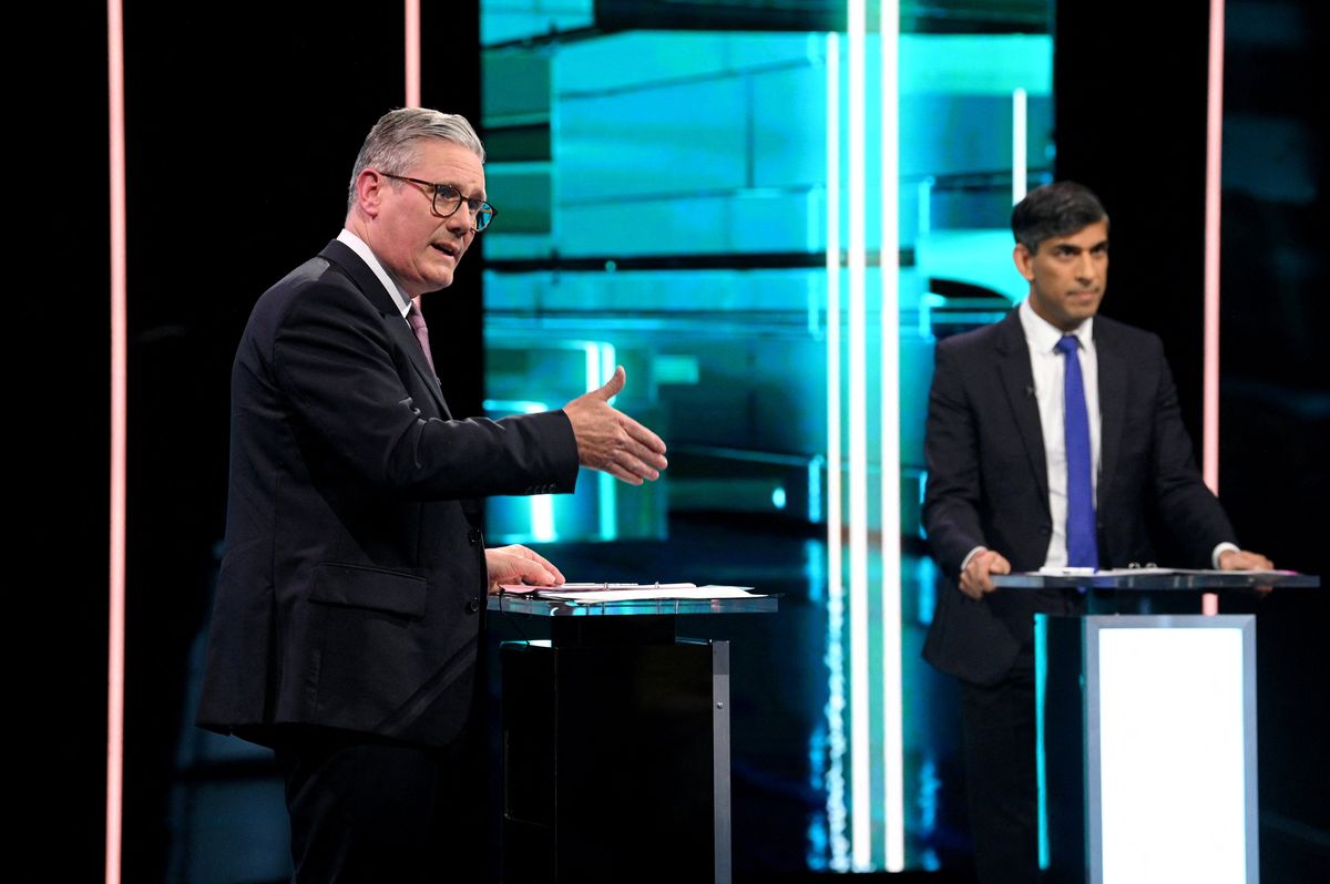 Labour Party leader Keir Starmer and Conservative Party leader and Prime Minister Rishi Sunak debate, as ITV hosts the first head-to-head debate of the General Election, in Manchester, Britain, June 4, 2024 in this handout image. J