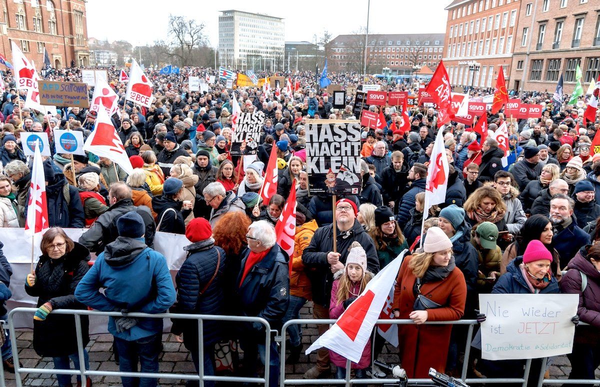 ​A demonstrator holds a sign reading "Hate makes you small" at a rally organized by the German Trade Union Confederation on "For Democracy and Solidarity" on Jan. 27, 2024. 