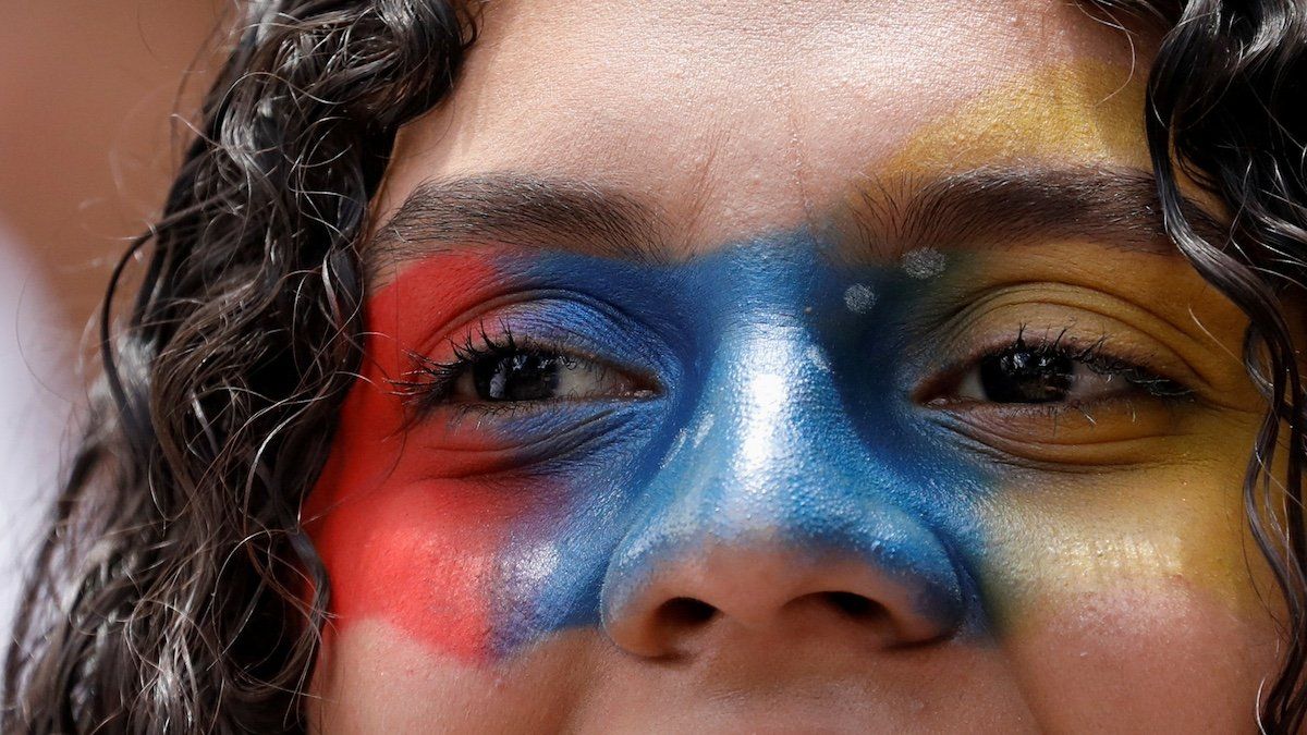 ​A demonstrator looks on during a protest against election results that awarded Venezuela's President Nicolas Maduro with a third term, in Caracas, Venezuela, August 3, 2024. 