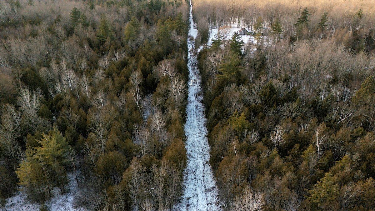 ​A drone view shows the Canada-U.S. border between the U.S. state of New York and the Canadian province of Quebec, near Champlain, New York, U.S., December 6, 2024. 