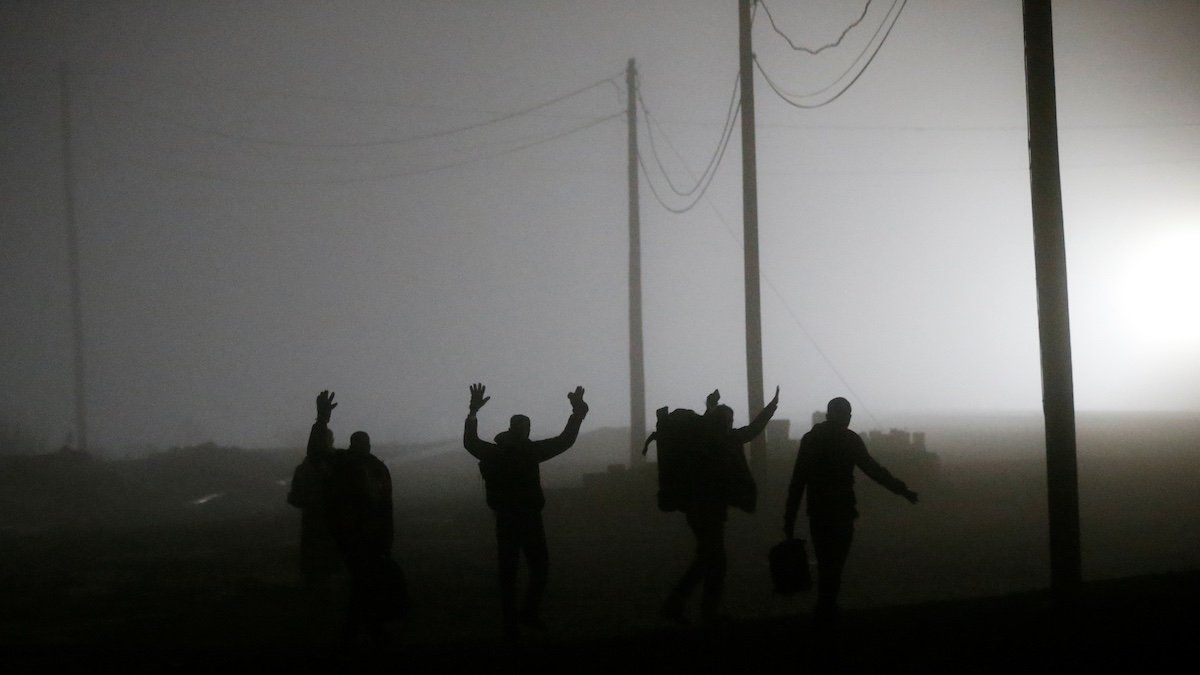 ​A group of migrants who said they were from Djibouti and Somalia follow railway tracks towards the Canada-U.S. border as seen from Emerson, Manitoba, Canada, March 27, 2017. Picture taken March 27, 2017. 