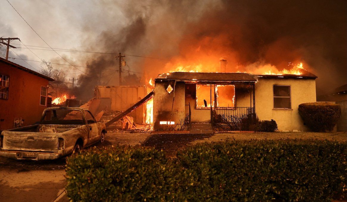 ​A house burns as powerful winds fueling devastating wildfires in the Los Angeles area force people to evacuate, in Altadena, California, on Jan. 8, 2025. 