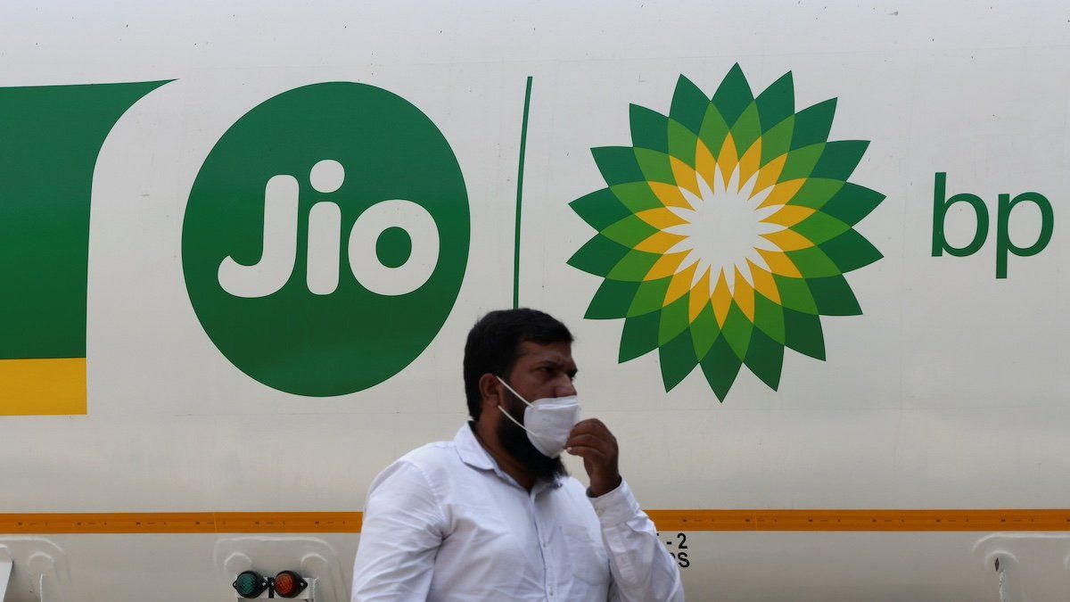 ​A man walks past a Jio-bp fuel tanker, an Indian fuel and mobility joint venture between Reliance Industries (RIL) and British Petroleum (bp), in Navi Mumbai, India, October 26, 2021 