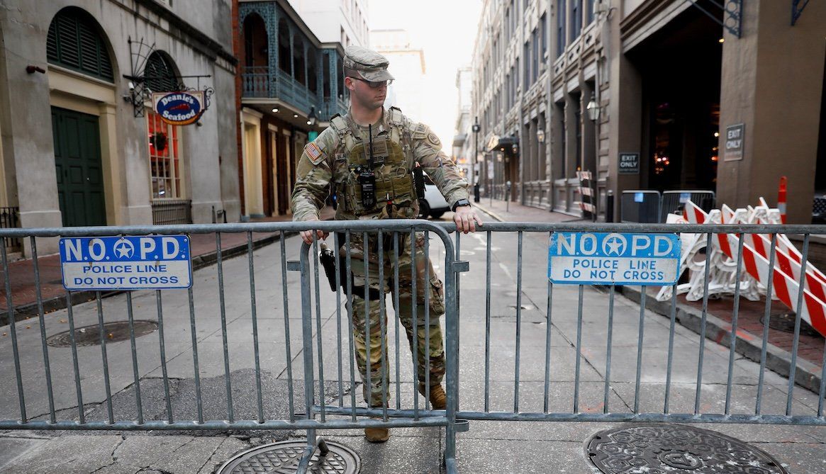 ​A member of the National Guard Military Police stands in the area where people were killed by a man driving a truck in an attack during New Year's celebrations, in New Orleans, Louisiana, on Jan. 2, 2025. 