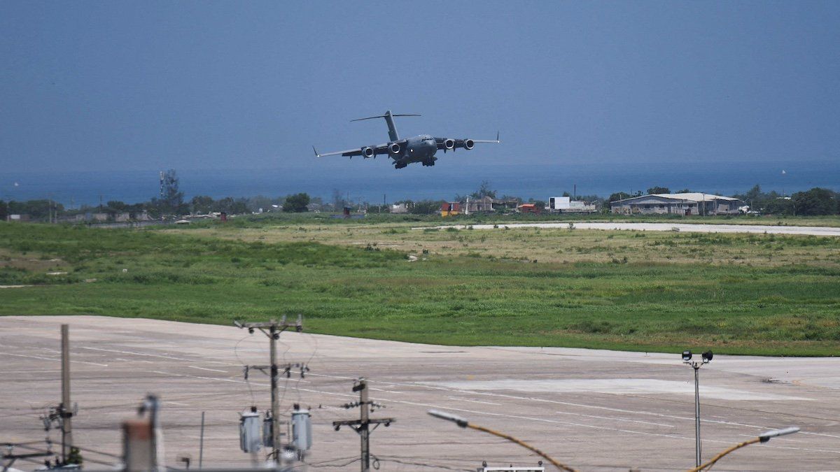 ​A U.S. force aircraft arrives with contractors to build a base for a Kenyan-led international security force aimed at countering gang violence, in Port-au-Prince, Haiti May 11, 2024. 