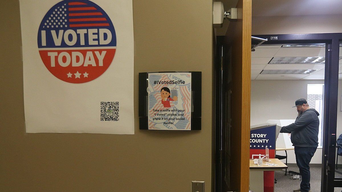 A voter drop ballet papers in a ballet box on the early in-person voting In the general election at Story County Administrative Building on Wednesday, Oct. 23, 2024, in Nevada, Iowa.