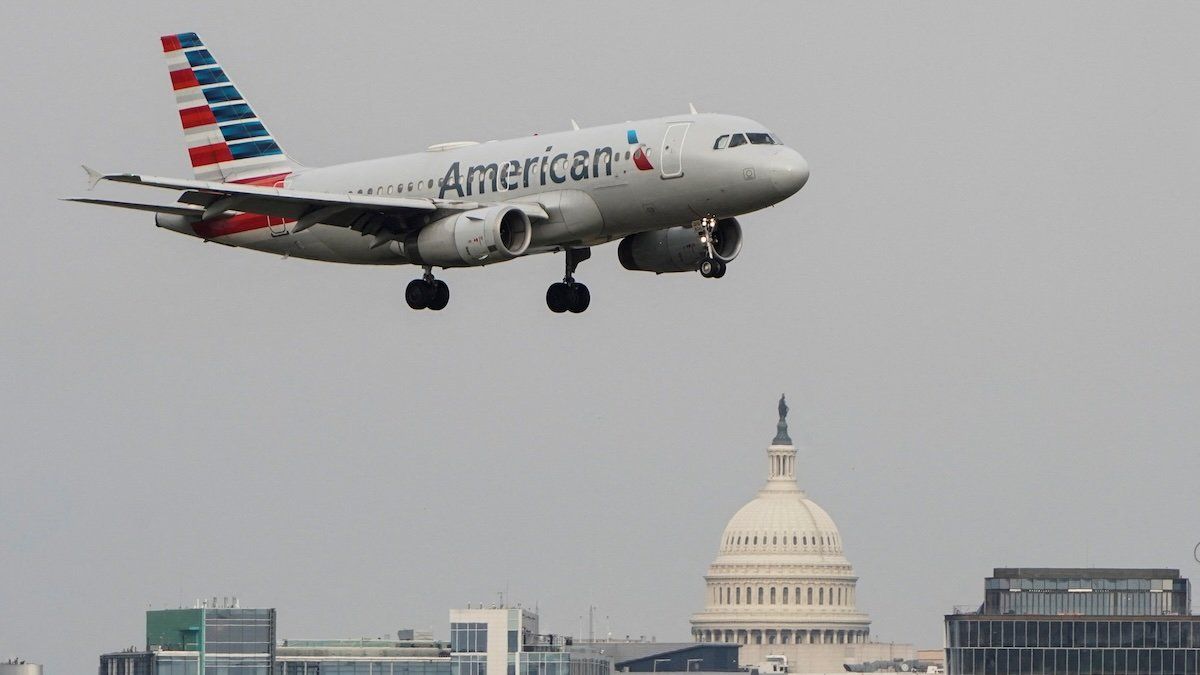 An American Airlines aircraft flies past the U.S. Capitol before landing at Reagan National Airport in Arlington, Virginia, U.S., January 24, 2022. 